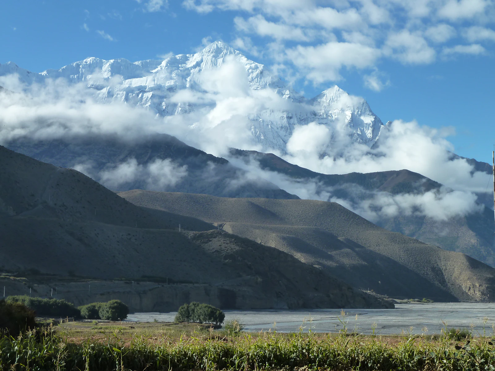 The Kali Gandaki valley floor in Mustang with a snow-capped peak rising above arid ridges, Nepal