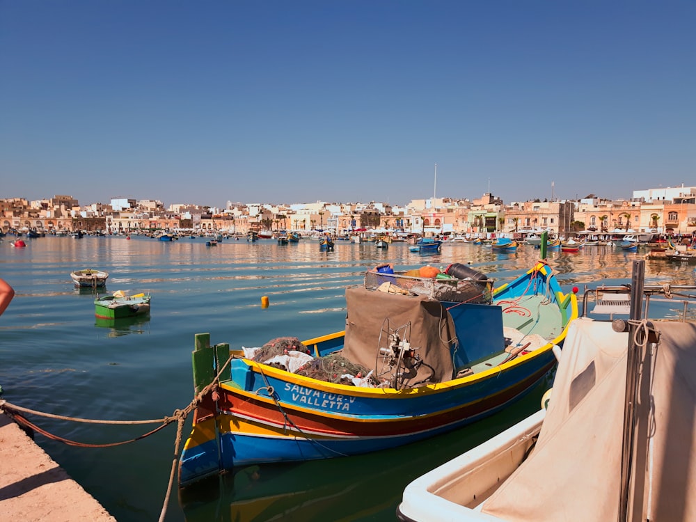 brown and green boat on body of water during daytime