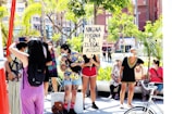 people standing on sidewalk during daytime