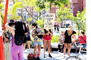 people standing on sidewalk during daytime