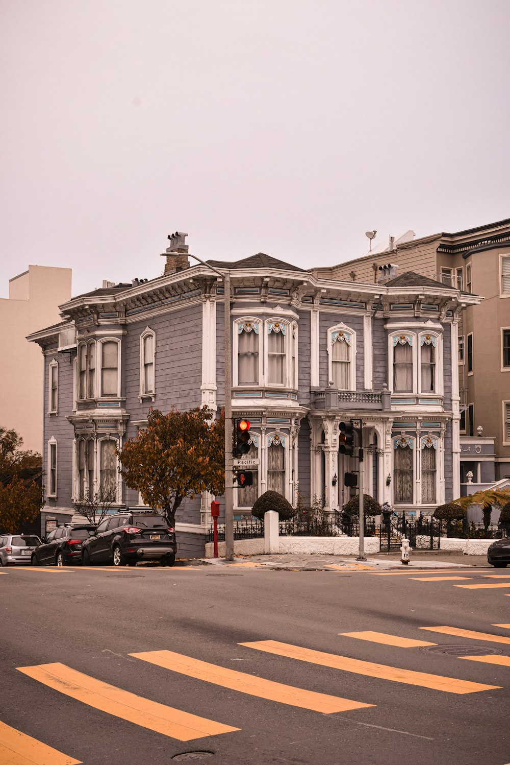 cars parked in front of white building