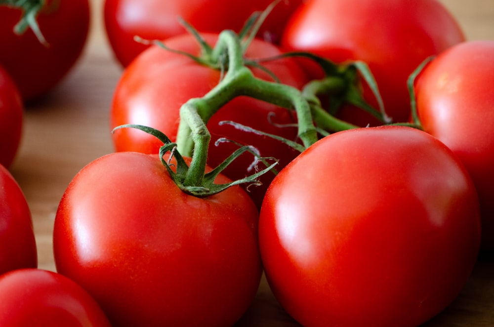 red tomato on white table