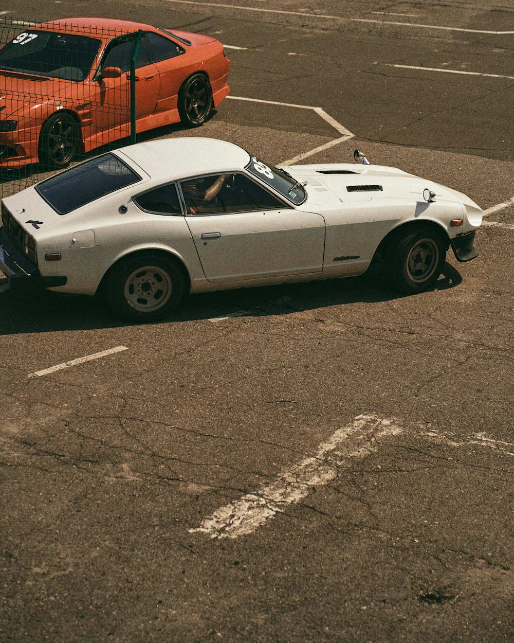 white porsche 911 parked on road during daytime