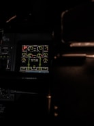 Cockpit dashboard displaying flight performance data with first officer overlay.