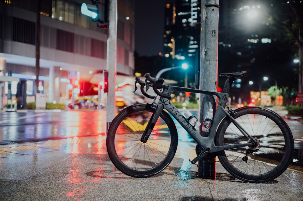 black and gray bicycle on road during daytime