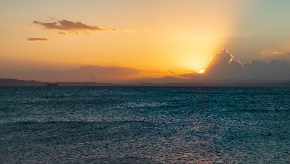 body of water during sunset