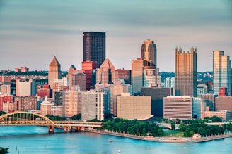 high rise buildings near body of water during daytime