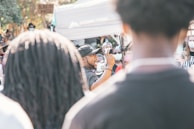 Close-up of a speaker passionately addressing supporters at an outdoor event.