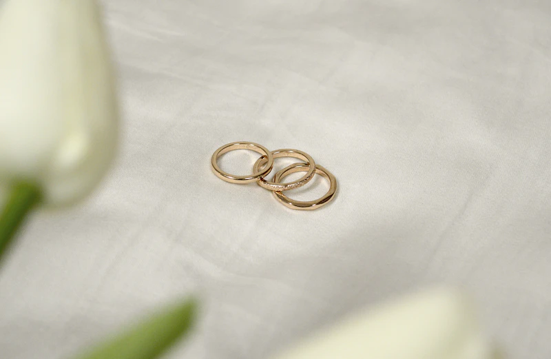 Rose gold stacking rings with gemstone accents