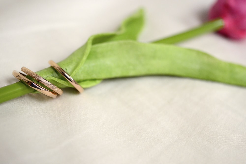 green leaf on white textile