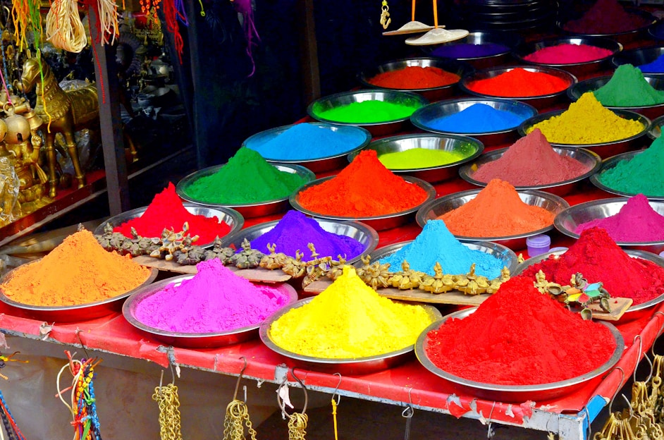 A colorful display of vibrant Holi powders and festive items ready for celebration.