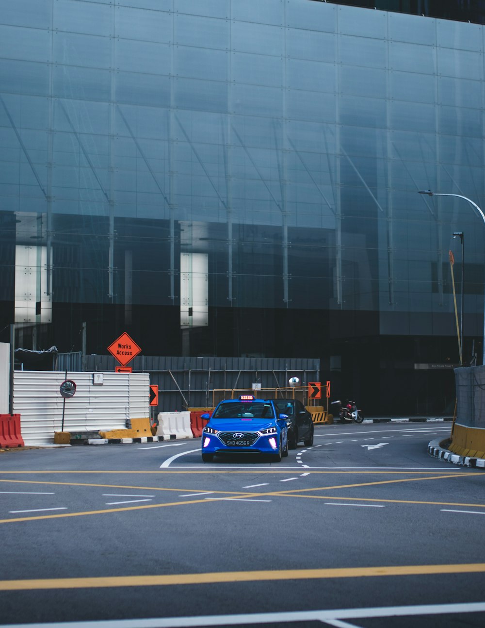 blue and red car on road