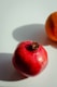 red apple fruit beside orange fruit