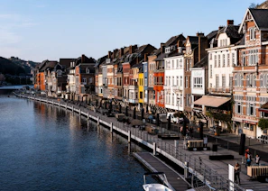 body of water between buildings during daytime