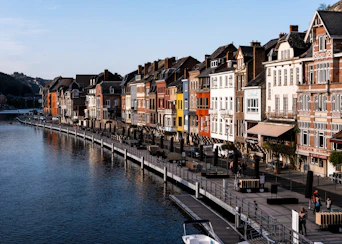 body of water between buildings during daytime