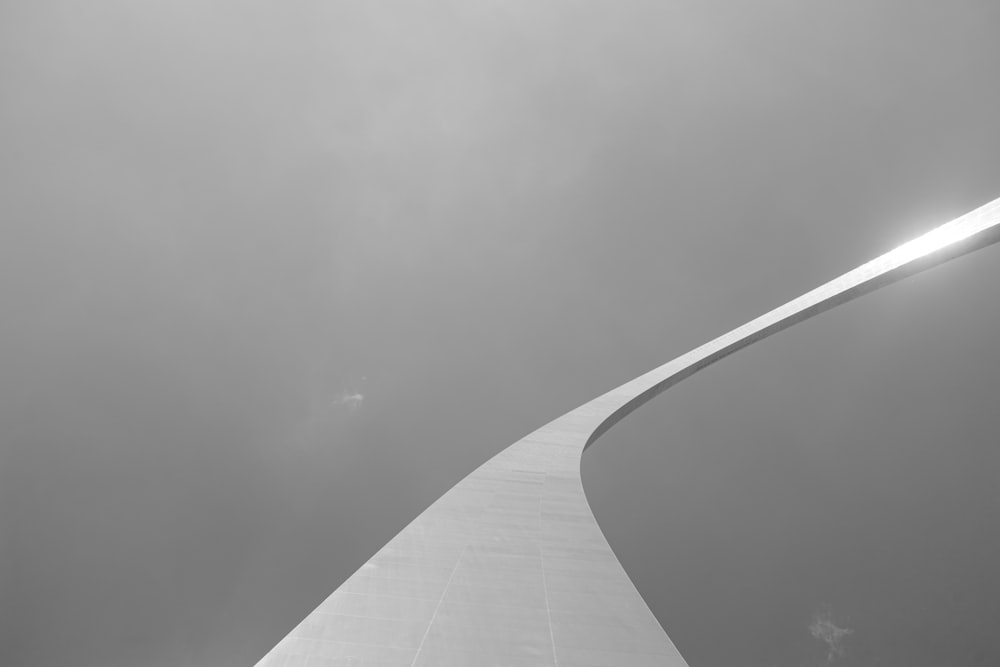 grayscale photo of a tunnel