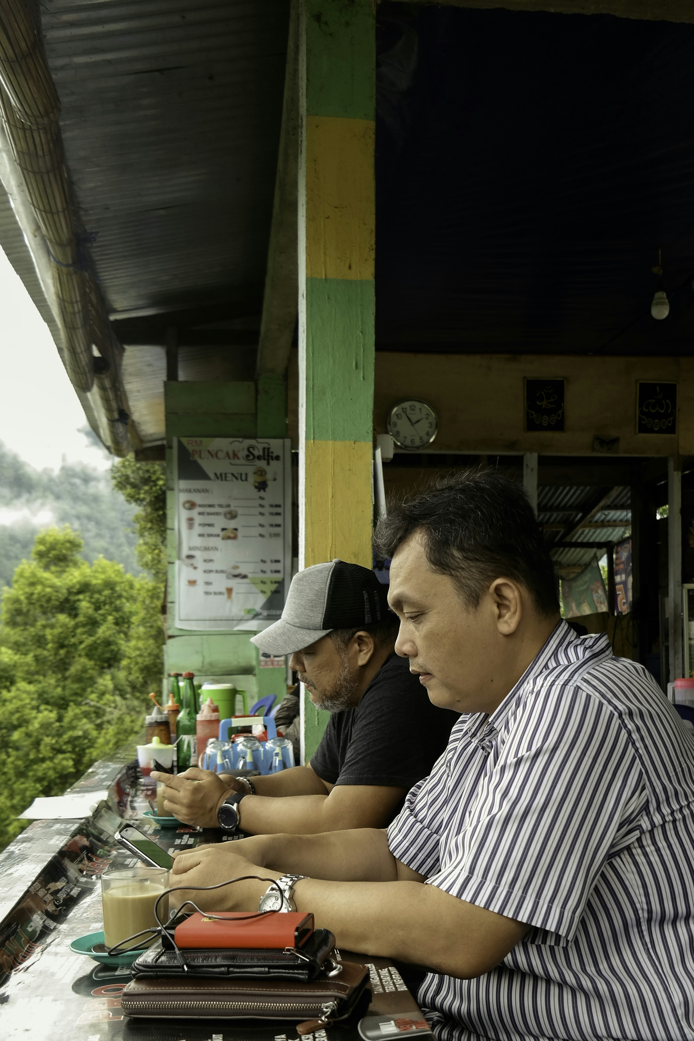 two men with handphone and internet.