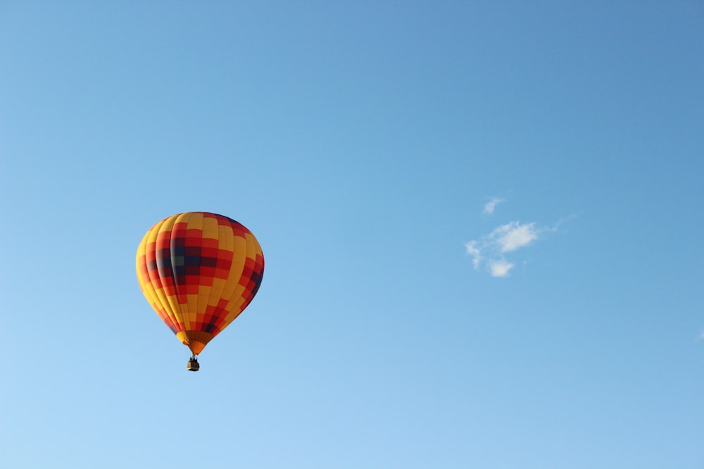 red yellow and blue hot air balloon in the sky