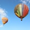 yellow red and blue hot air balloon under blue sky during daytime