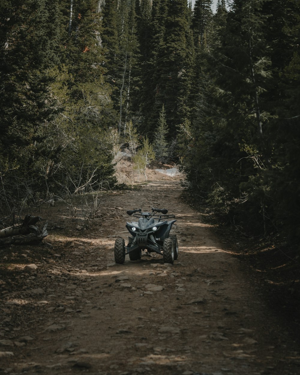 black and gray motorcycle on brown dirt road during daytime