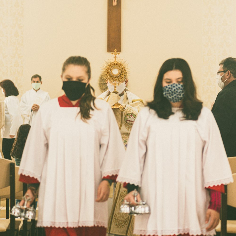 group of people wearing white robe