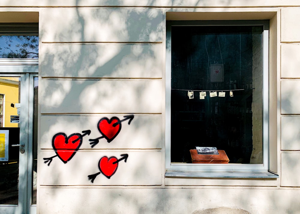 red heart wall decor on white wall