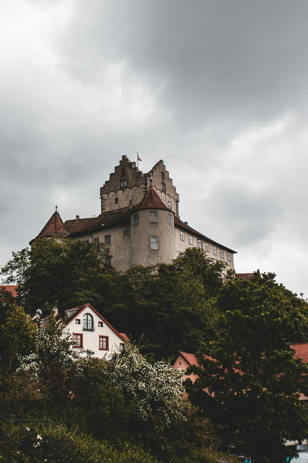 brown and gray concrete building under cloudy sky during daytime