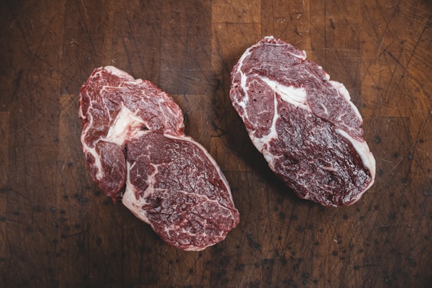 sliced meat on brown wooden table