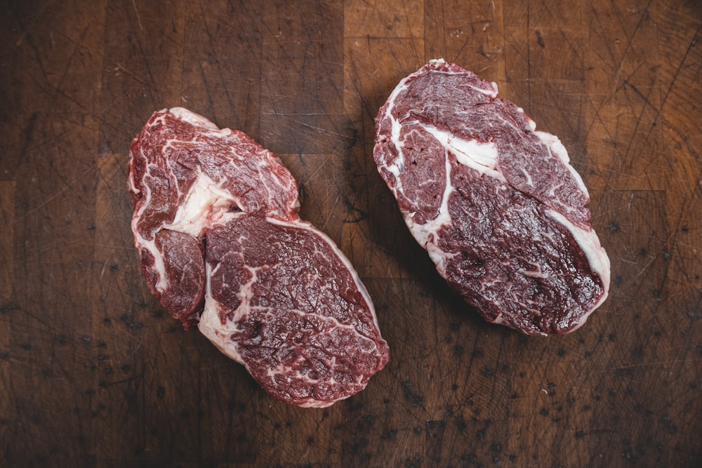 sliced meat on brown wooden table