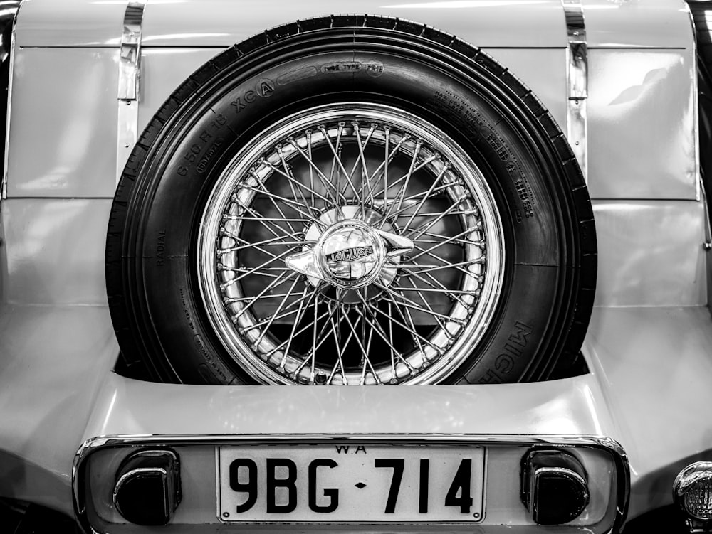 grayscale photo of car wheel