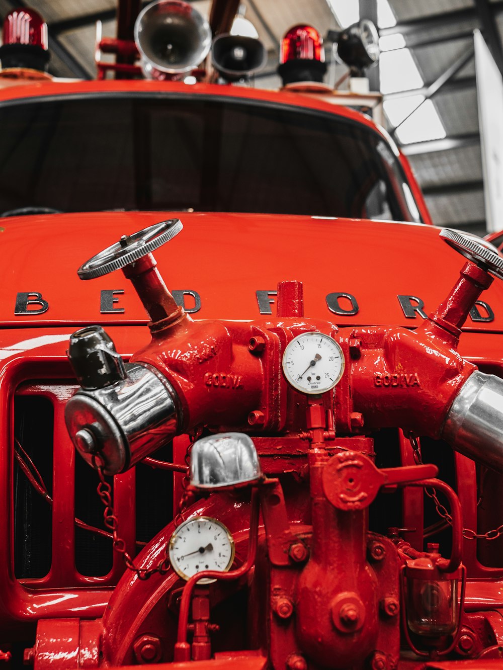 red car with white and red analog clock