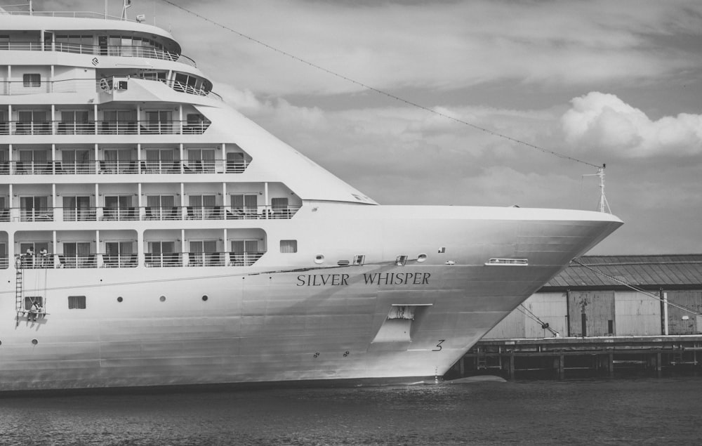 white ship on body of water during daytime