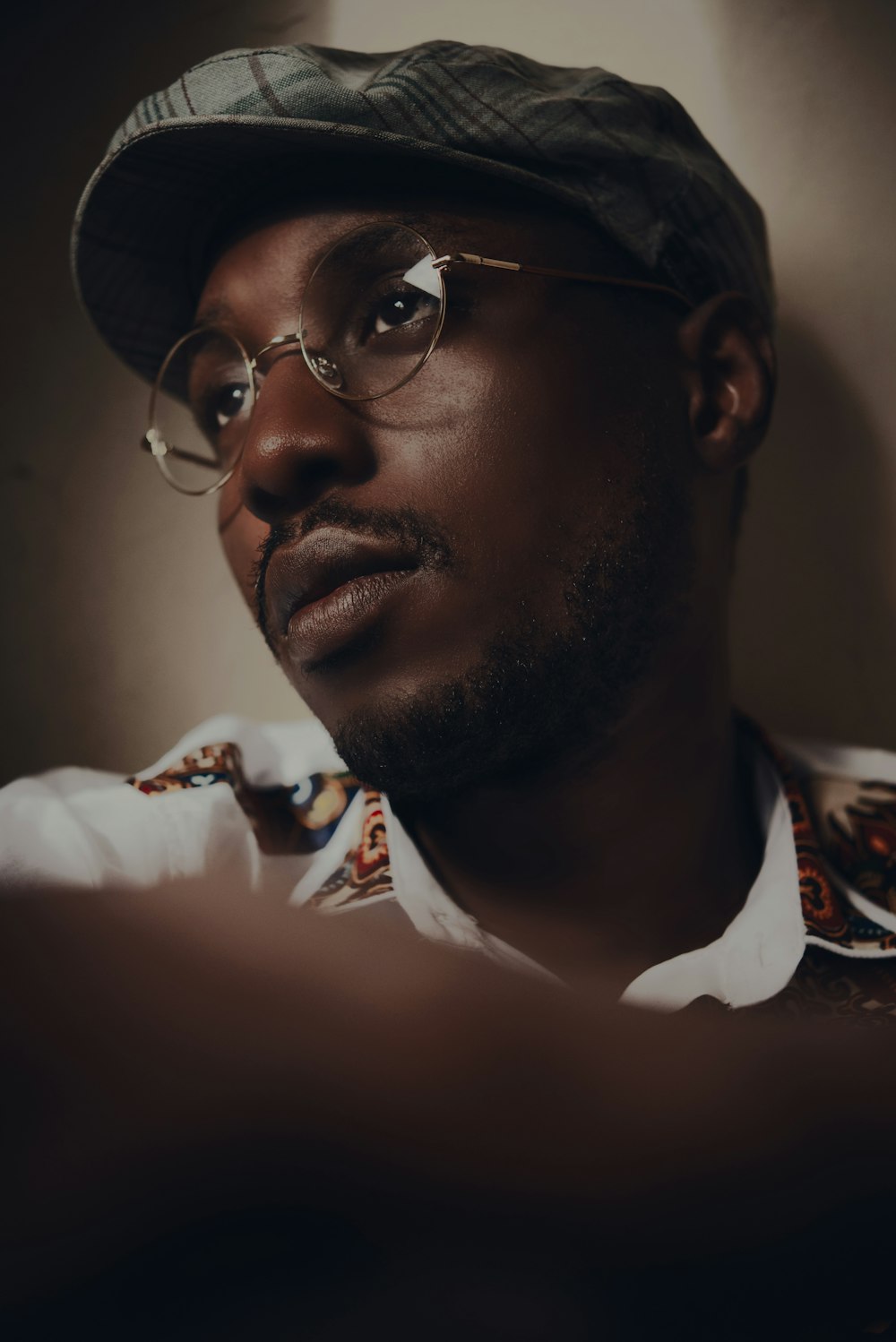 man in black framed eyeglasses and white collared shirt