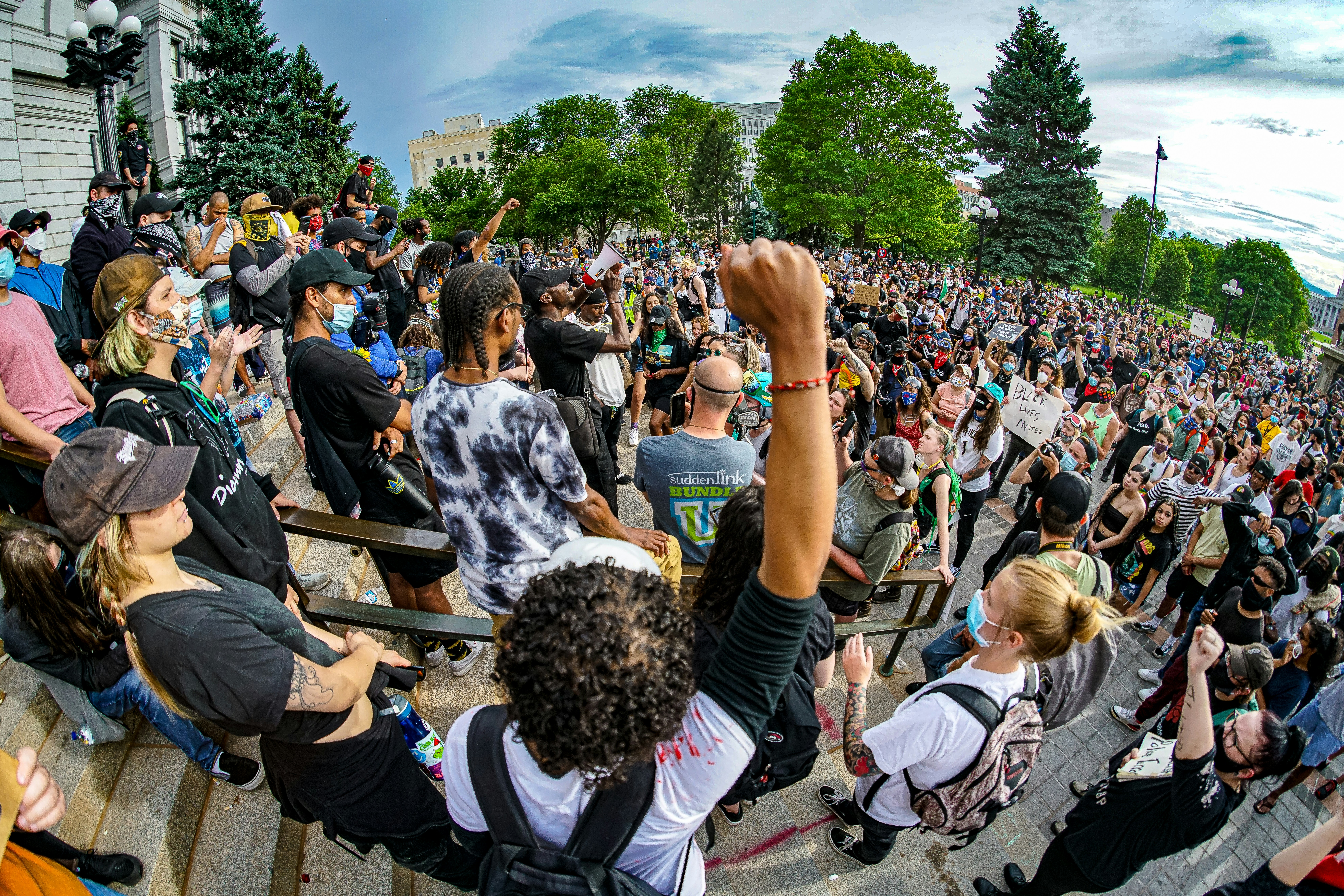 Large crowd gathered at a Denver craft beer festival on a sunny fall day