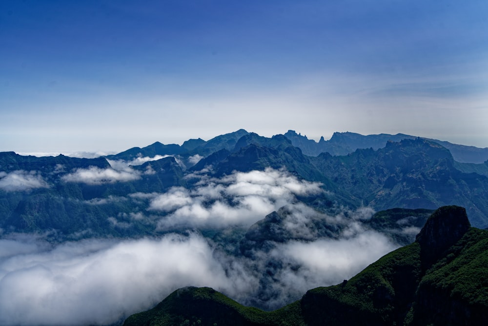 green mountains under white clouds during daytime