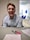 A close-up of a satisfied customer reviewing billing documents with a smile.