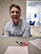 A satisfied customer reviewing notes at a desk.