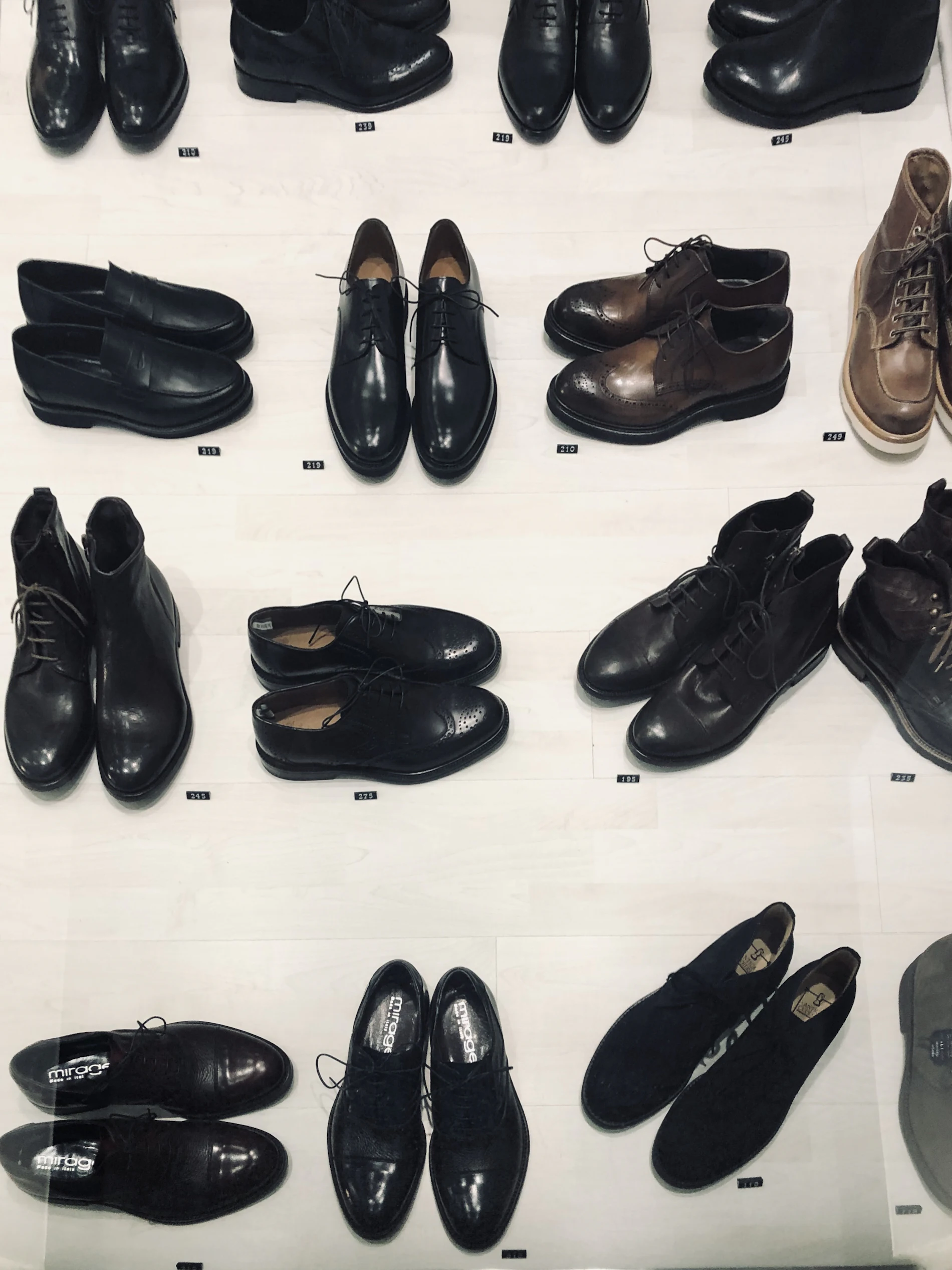 Rows of finished black leather shoes