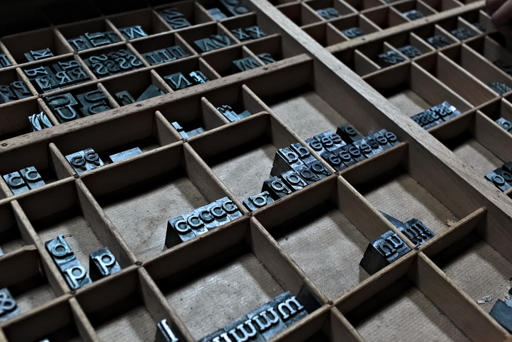 brown wooden cube blocks on brown wooden shelf