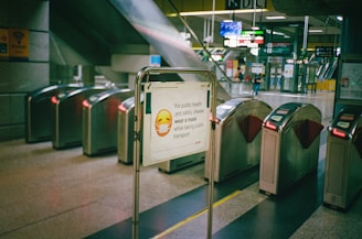 white and black signage on gray metal pole