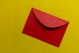 red paper on yellow surface