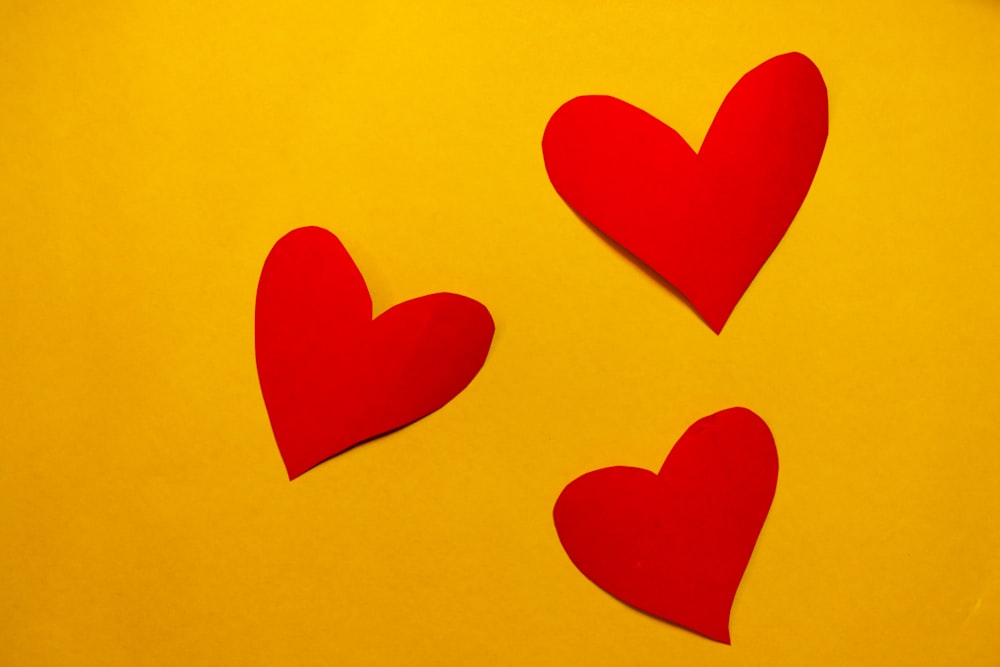 red hearts on yellow paper