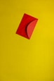 orange paper on yellow surface