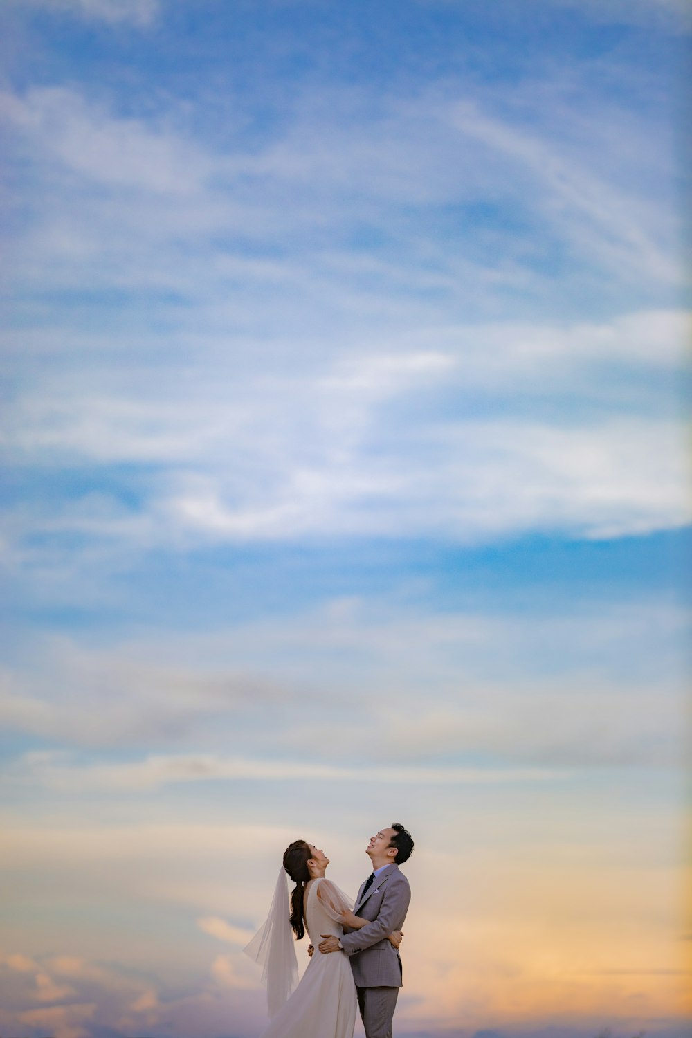 2 person standing under blue sky during daytime