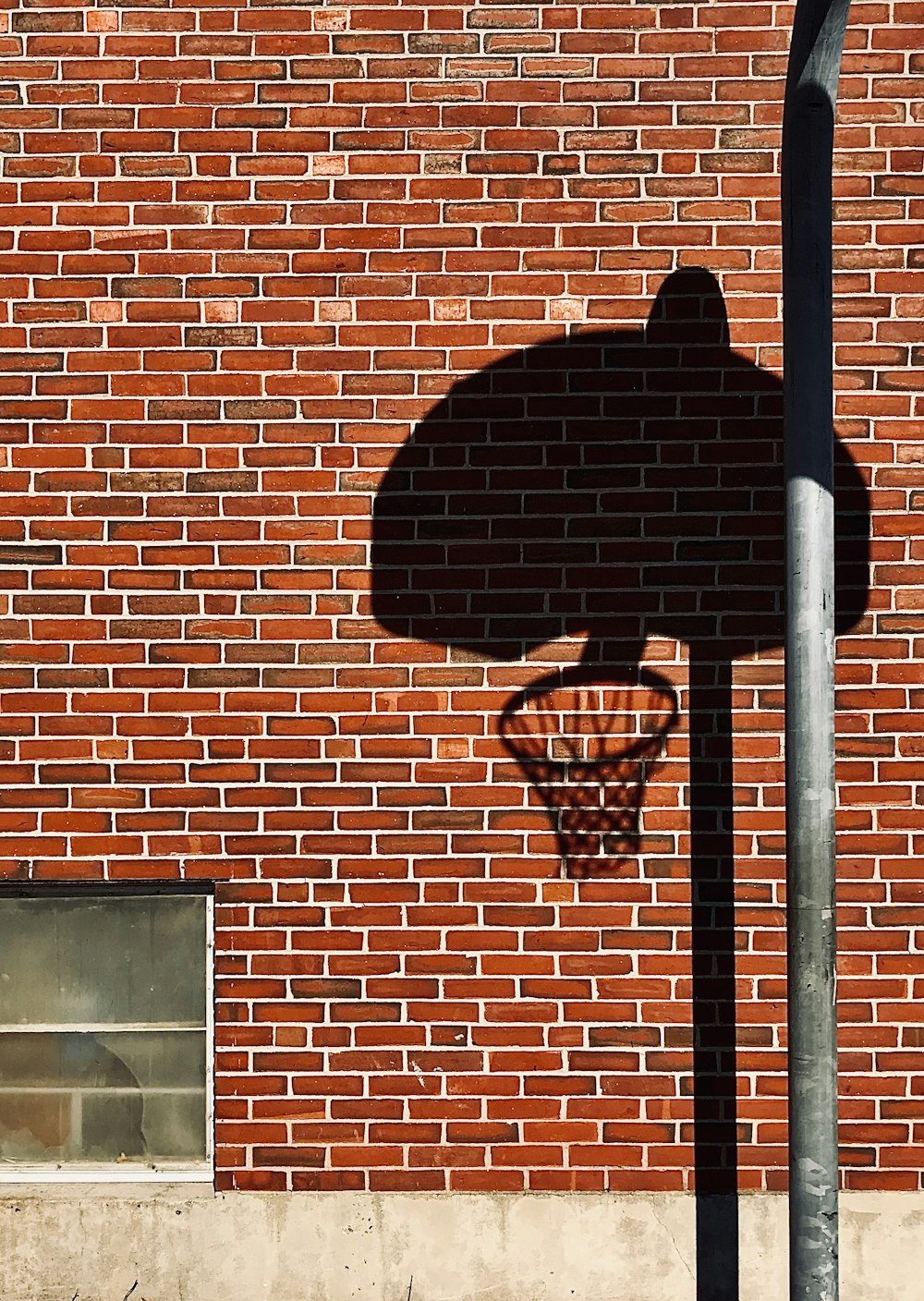 basketball hoop on brown brick wall