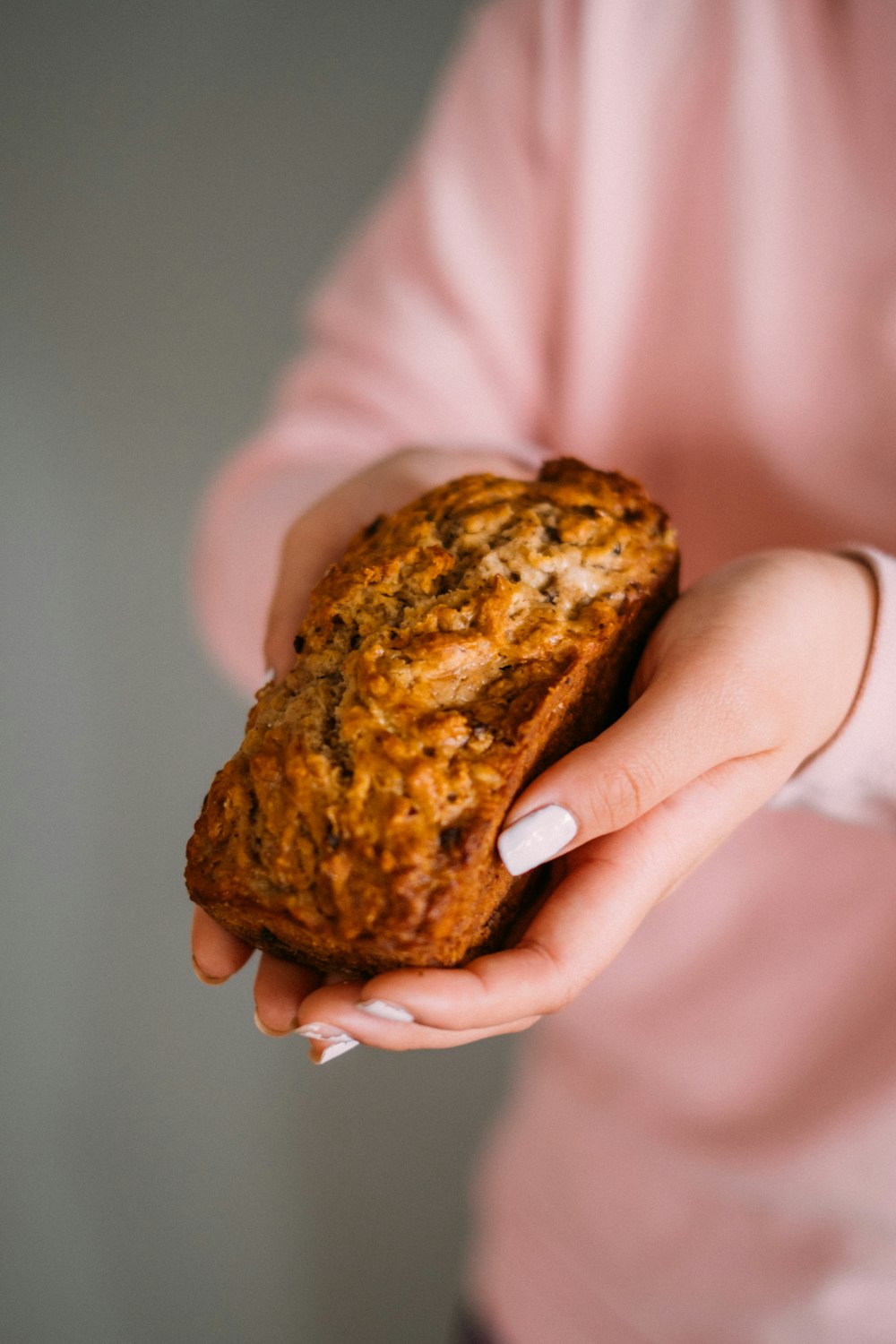 person holding brown bread with chocolate