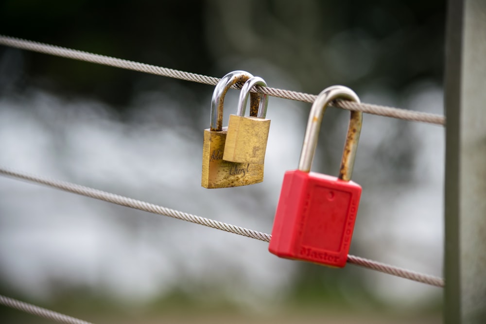 red padlock on gray wire