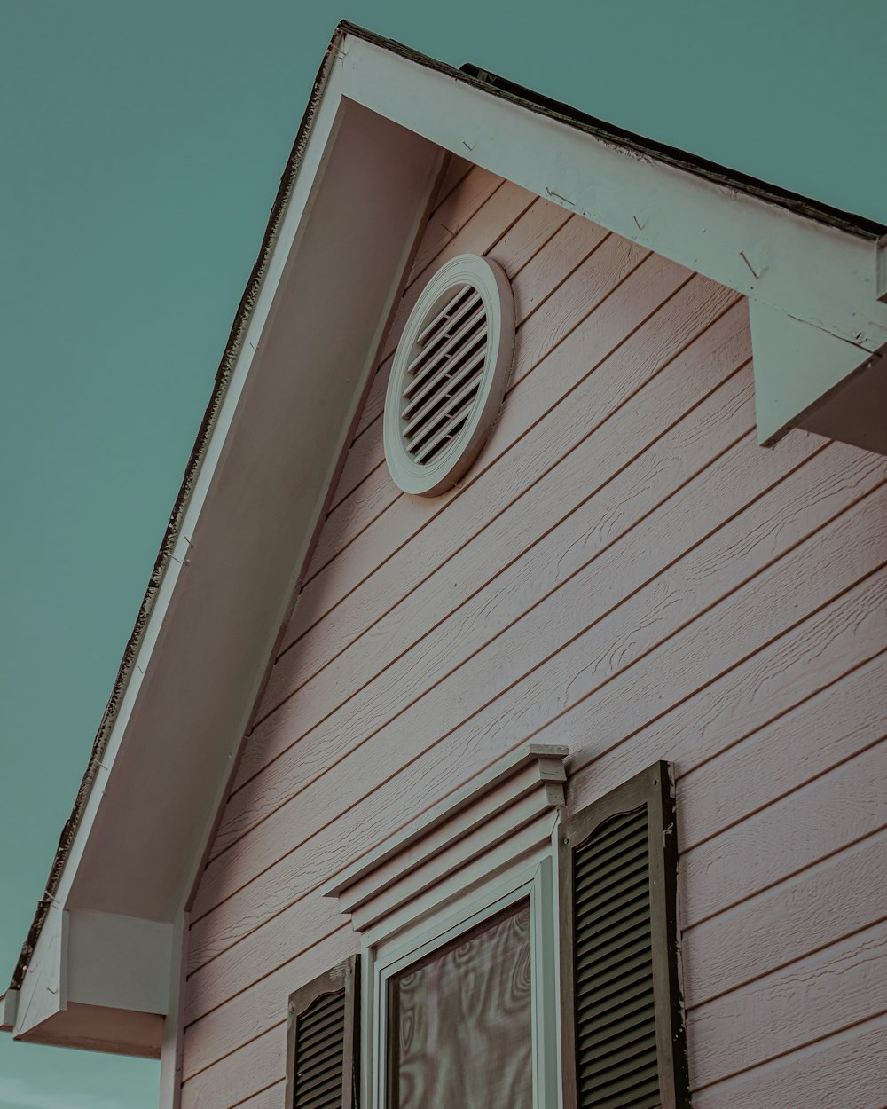 white wooden house with white window