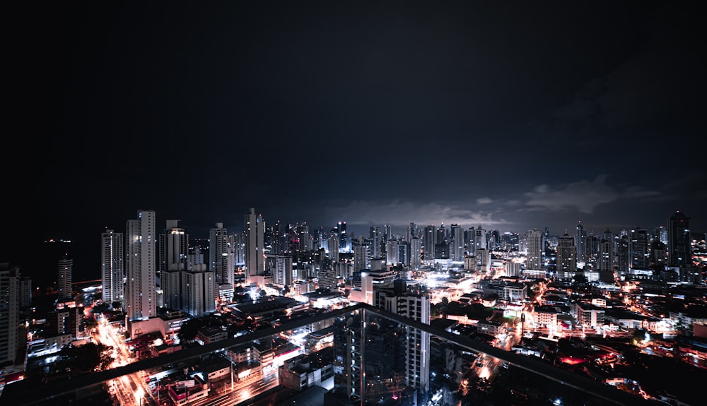 city with high rise buildings during night time