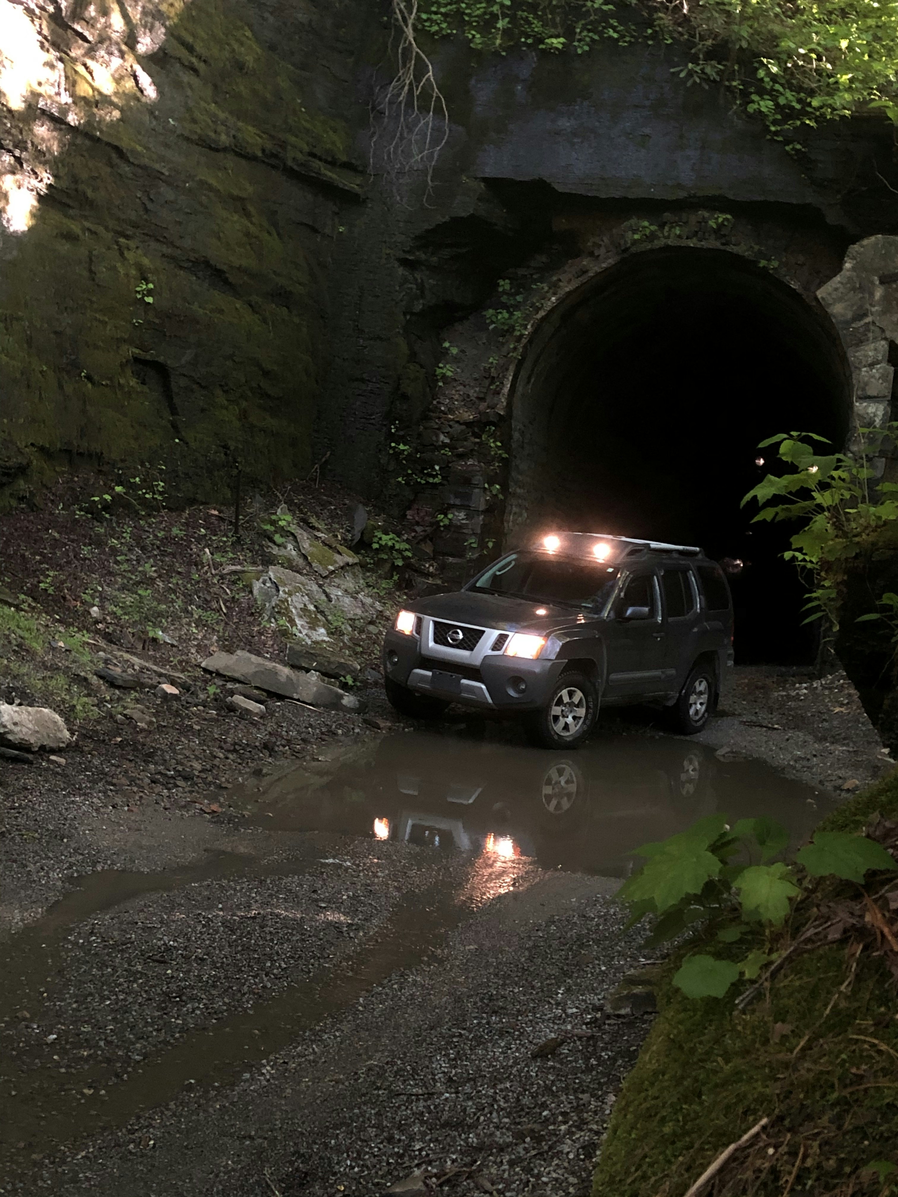 Nissan Xterra driving through an old train tunnel in northeast Tennessee